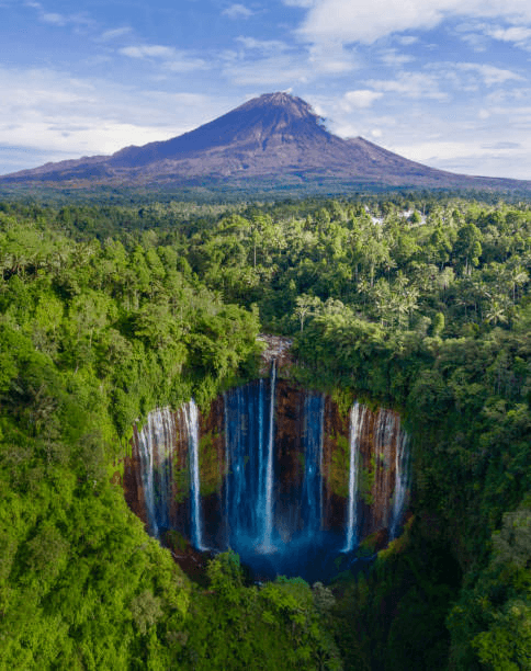 Tumpak Sewu waterfall with Mount Semeru behind