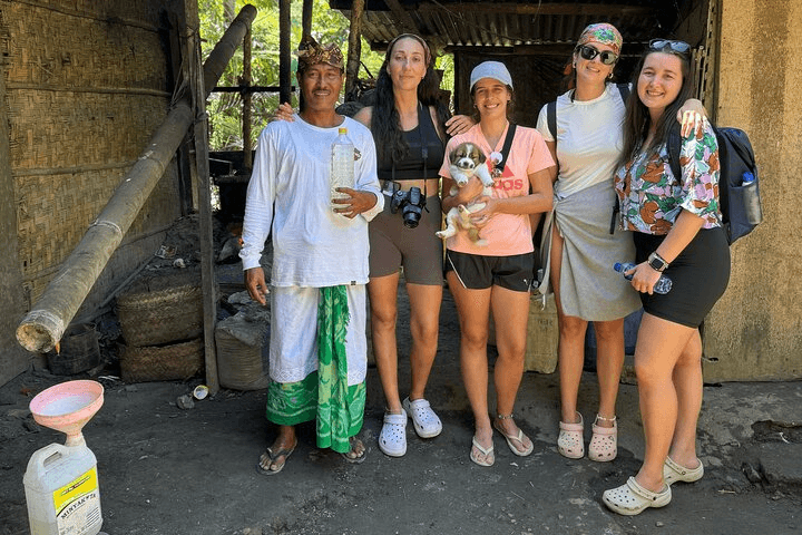 Guests with a village host and a puppy