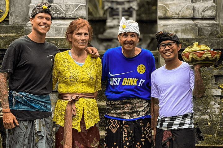 Guests in Balinese ceremonial dress at a temple