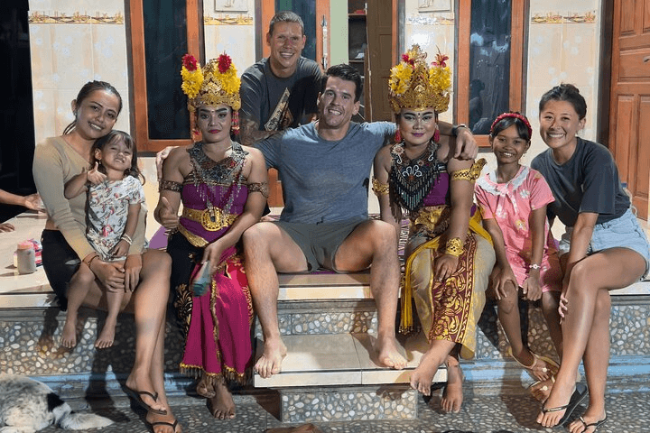 Guests and host family in traditional costume